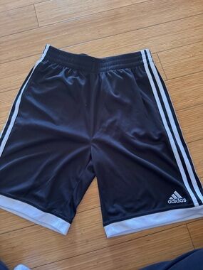 Adidas youth  Black Athletic Shorts with White Trim. New. No tags
